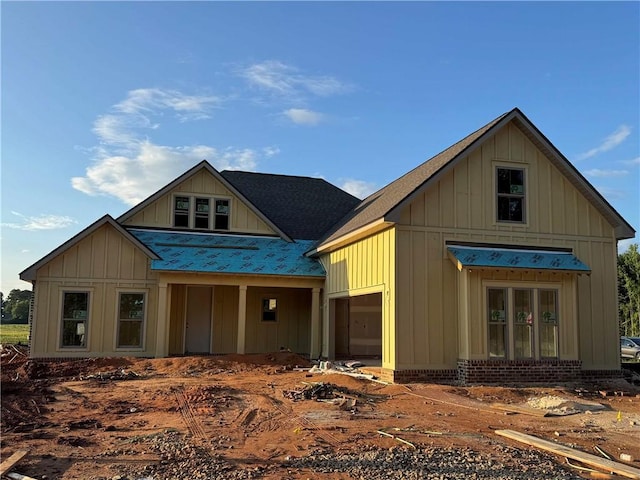 9291 Parker Ln, Daphne, AL 36526 - view of front of home featuring board and batten siding and roof with shingles