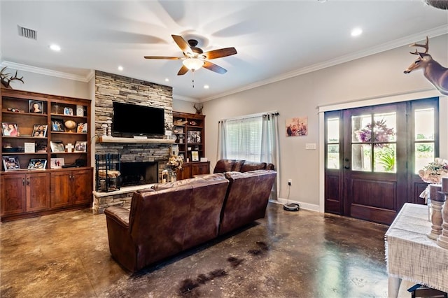 living room featuring a stone fireplace, crown molding, ceiling fan, and concrete floors