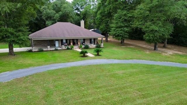 view of community featuring a yard