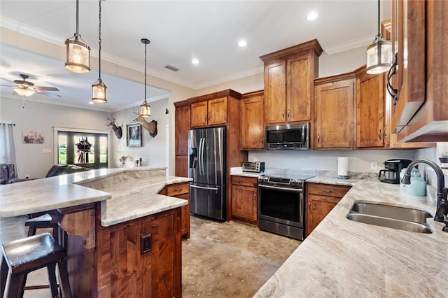 kitchen featuring pendant lighting, a kitchen breakfast bar, sink, ceiling fan, and stainless steel appliances