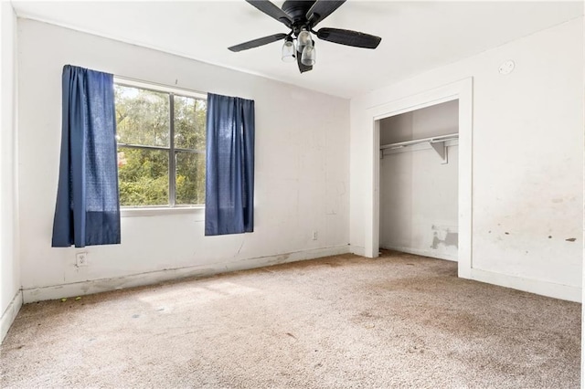 unfurnished bedroom featuring a closet, ceiling fan, and carpet floors