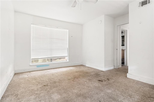 empty room featuring carpet and ceiling fan