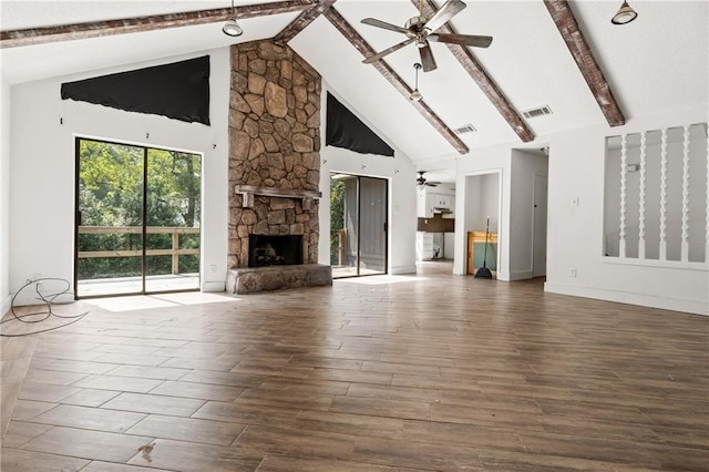 unfurnished living room with a fireplace, hardwood / wood-style floors, ceiling fan, high vaulted ceiling, and beam ceiling