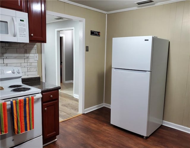 kitchen with backsplash, crown molding, dark hardwood / wood-style floors, and white appliances