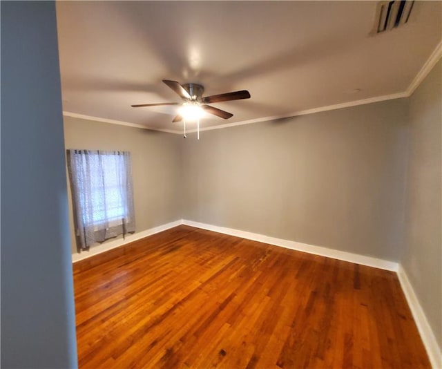 spare room with hardwood / wood-style flooring, ceiling fan, and crown molding