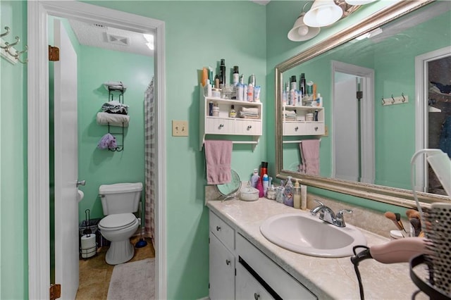 bathroom featuring vanity, curtained shower, and toilet