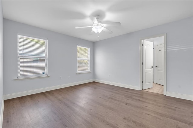 2107 Wolf Branch Dr N, Mobile, AL 36608 - spare room featuring wood finished floors, baseboards, and ceiling fan