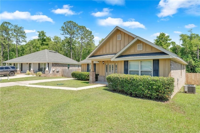 2107 Wolf Branch Dr N, Mobile, AL 36608 - view of front of house with board and batten siding, brick siding, and cooling unit