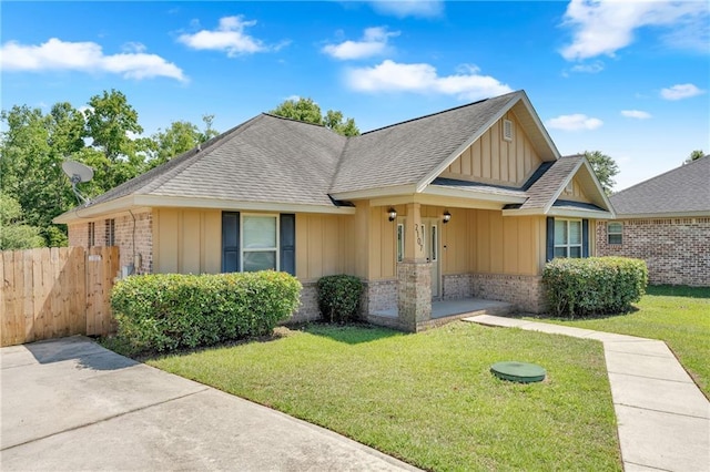 2107 Wolf Branch Dr N, Mobile, AL 36608 - view of front of property with board and batten siding, brick siding, and a shingled roof