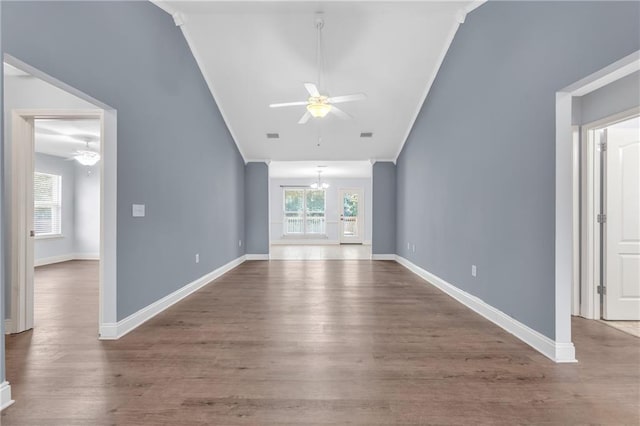 2107 Wolf Branch Dr N, Mobile, AL 36608 - unfurnished living room with ceiling fan, vaulted ceiling, wood finished floors, a chandelier, and baseboards