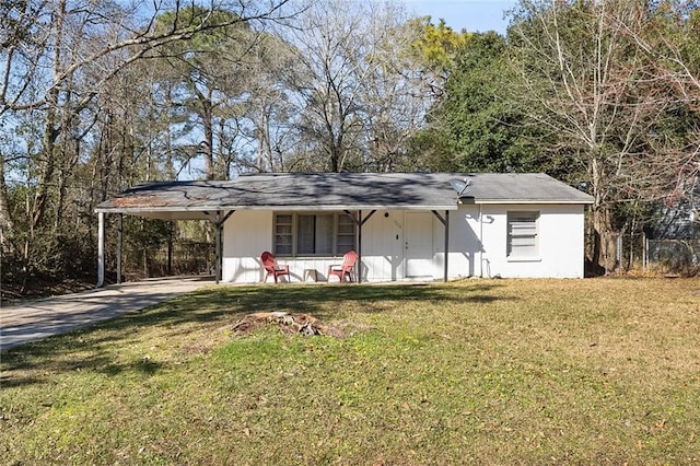 single story home with a front lawn, a carport, and concrete driveway