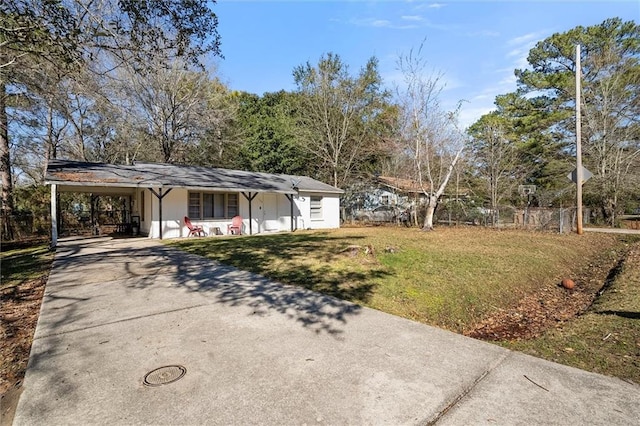 single story home with concrete driveway, a carport, a front yard, and fence