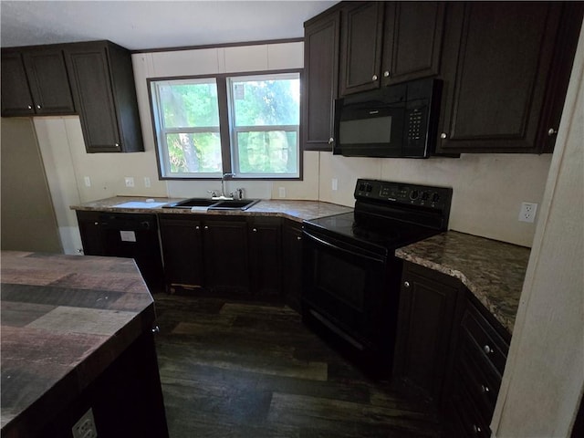 kitchen with black appliances, dark wood-type flooring, dark stone countertops, sink, and dark brown cabinets