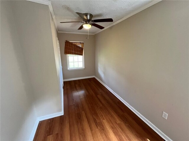 spare room featuring crown molding, a textured ceiling, hardwood / wood-style flooring, and ceiling fan