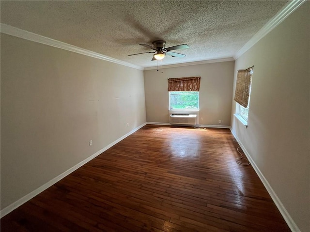 spare room with a textured ceiling, dark hardwood / wood-style flooring, cooling unit, ornamental molding, and ceiling fan