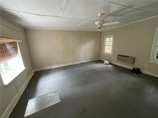 unfurnished room with ceiling fan and an AC wall unit