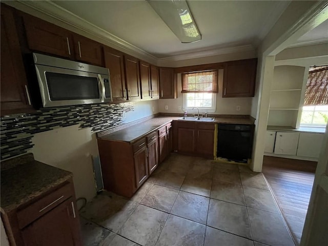 kitchen with ornamental molding, black dishwasher, plenty of natural light, and sink