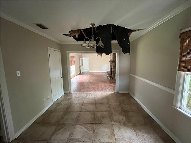 interior space with wood-type flooring, a fireplace, a chandelier, and ornamental molding