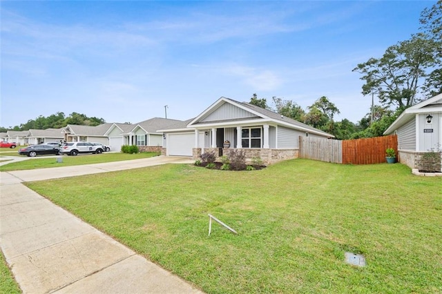 view of front facade with a garage and a front yard