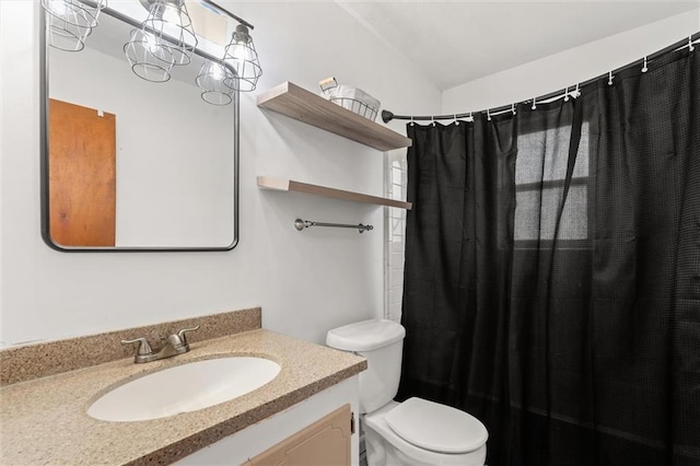 bathroom featuring vanity, toilet, and a shower with shower curtain