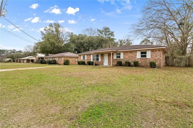 ranch-style house with a front lawn