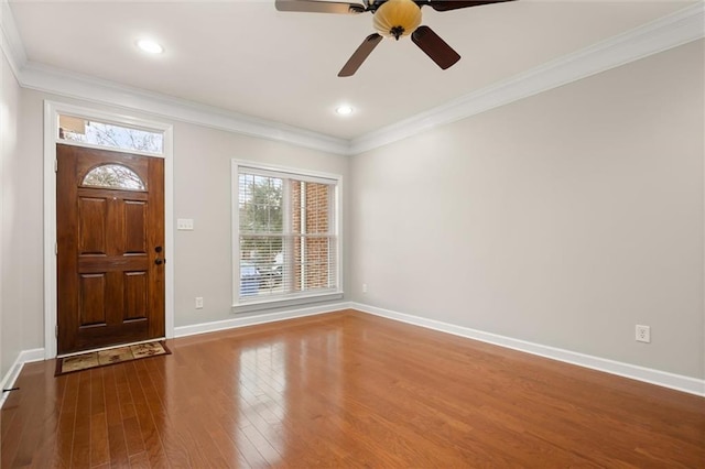 entryway with crown molding, wood-type flooring, and ceiling fan