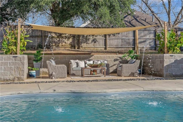 view of pool featuring an outdoor living space and pool water feature