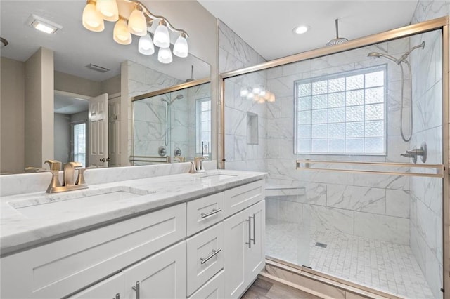 4625 Pine Blvd, Orange Beach, AL 36561 - bathroom with a shower stall, plenty of natural light, and double vanity
