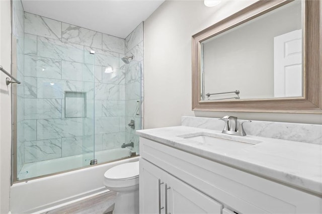 4625 Pine Blvd, Orange Beach, AL 36561 - bathroom with toilet, combined bath / shower with glass door, vanity, and wood finished floors