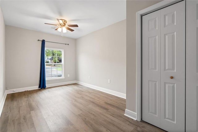 4625 Pine Blvd, Orange Beach, AL 36561 - empty room featuring ceiling fan, wood finished floors, and baseboards