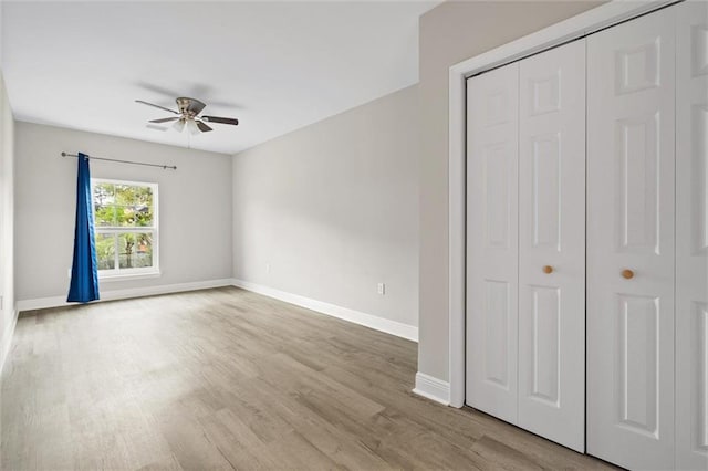 4625 Pine Blvd, Orange Beach, AL 36561 - unfurnished bedroom with baseboards, wood finished floors, a closet, and a ceiling fan