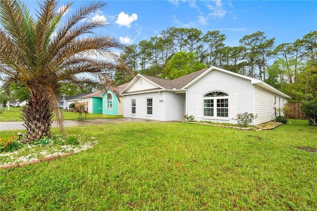 4625 Pine Blvd, Orange Beach, AL 36561 - rear view of property featuring a yard
