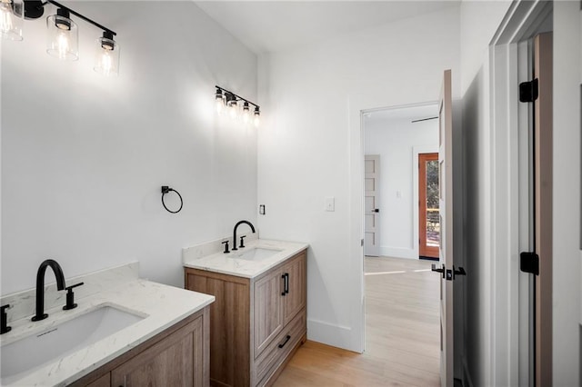 bathroom featuring vanity and hardwood / wood-style floors