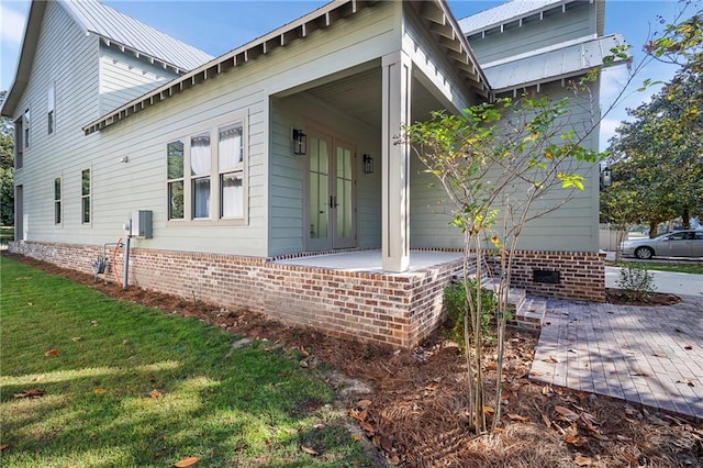 view of home's exterior with a yard