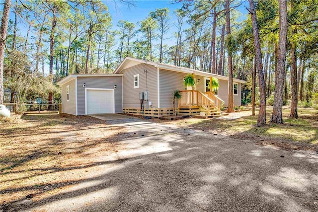 view of front facade with driveway and an attached garage