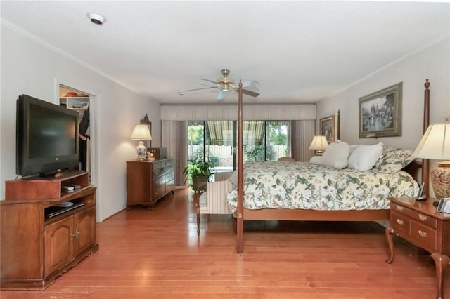 bedroom featuring light wood-type flooring and ornamental molding
