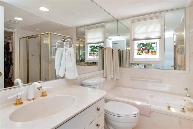 full bath featuring recessed lighting, toilet, vanity, a garden tub, and a stall shower