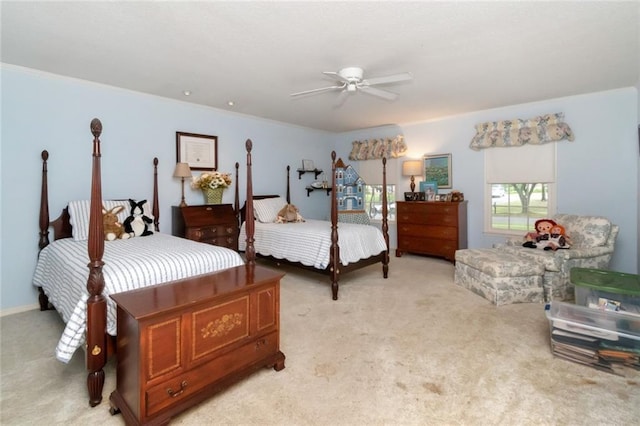 bedroom featuring ceiling fan and light carpet