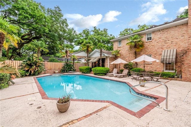 view of swimming pool with fence, a patio, and a fenced in pool