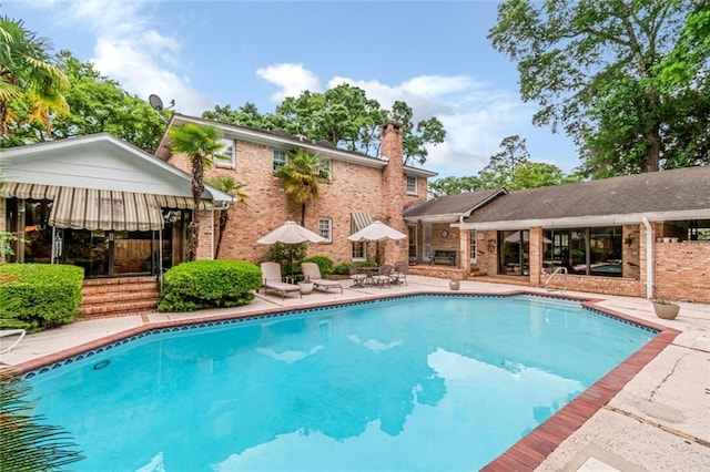 outdoor pool with a patio