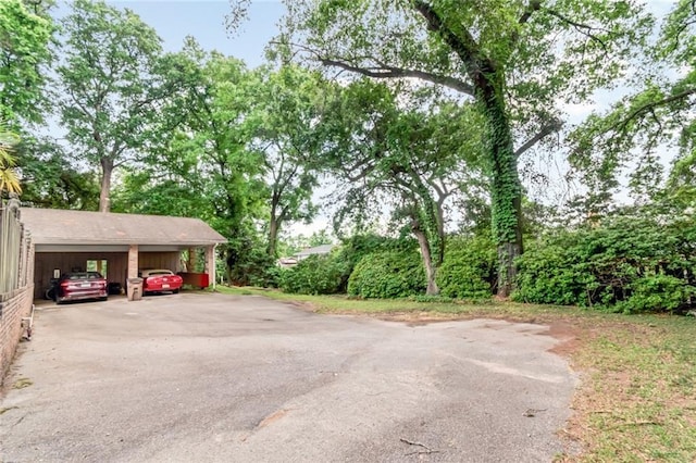 exterior space with driveway and a carport