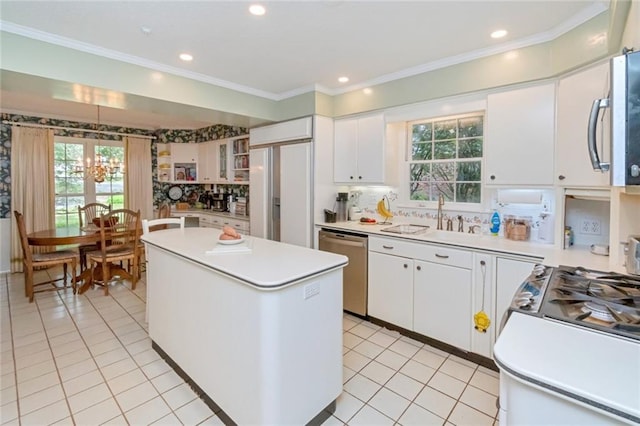 kitchen featuring light countertops, a center island, and stainless steel appliances