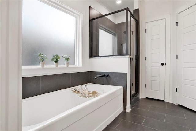 bathroom featuring tile patterned floors and plus walk in shower