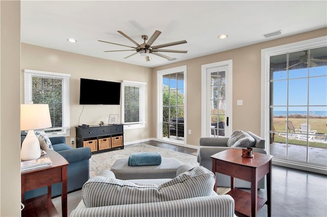 living room featuring concrete floors and ceiling fan