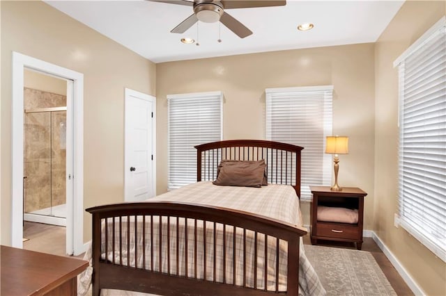 bedroom with ensuite bath and ceiling fan