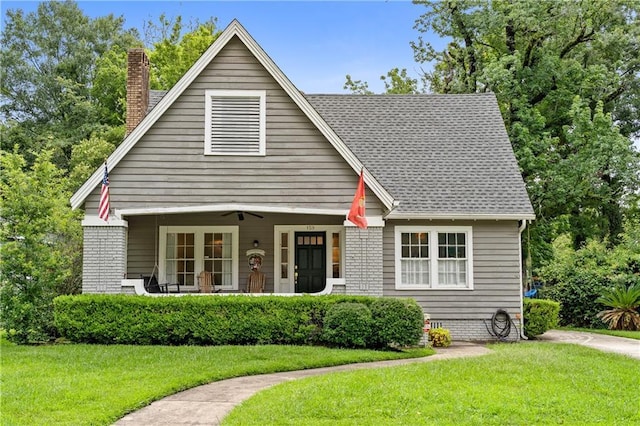 159 Roberts St, Mobile, AL 36604 - view of front of house featuring a chimney, a front lawn, and a shingled roof