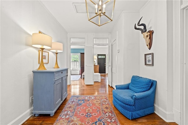 159 Roberts St, Mobile, AL 36604 - foyer entrance with a chandelier, wood finished floors, and ornamental molding