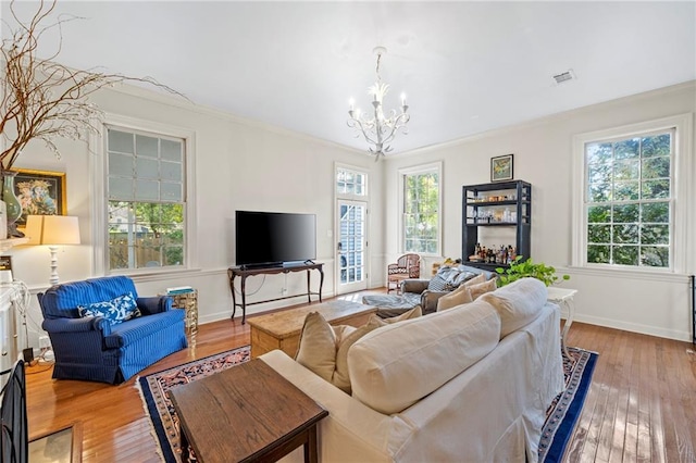159 Roberts St, Mobile, AL 36604 - living area featuring a chandelier, hardwood / wood-style floors, and crown molding
