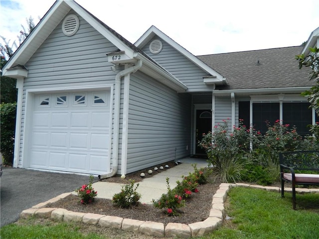 ranch-style home with a garage