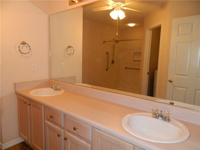 bathroom with ceiling fan and double vanity